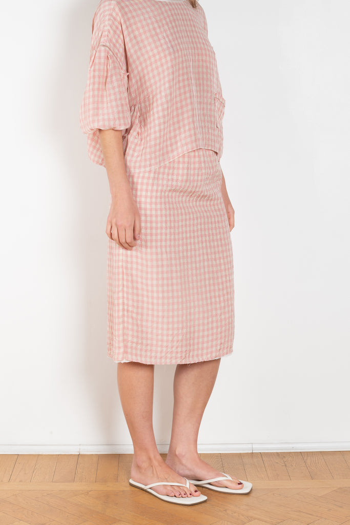 The Crayon Skirt by Nackiye is a knee length pencil skirt with loops. Gathered at the waist with a revealing petticoat