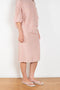 The Crayon Skirt by Nackiye is a knee length pencil skirt with loops. Gathered at the waist with a revealing petticoat