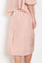 The Crayon Skirt by Nackiye is a knee length pencil skirt with loops. Gathered at the waist with a revealing petticoat