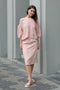 The Crayon Skirt by Nackiye is a knee length pencil skirt with loops. Gathered at the waist with a revealing petticoat