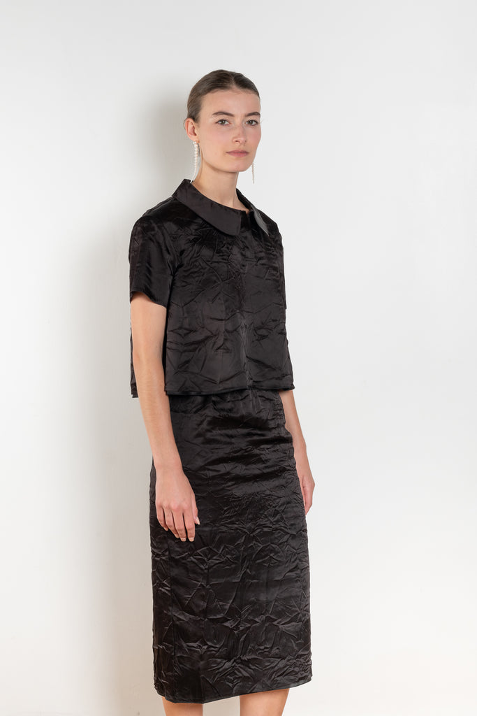 The Crayon Skirt by Nackiye is a knee length pencil skirt with raw edging and a slight noir petticoat reveal.