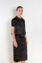 The Crayon Skirt by Nackiye is a knee length pencil skirt with raw edging and a slight noir petticoat reveal.