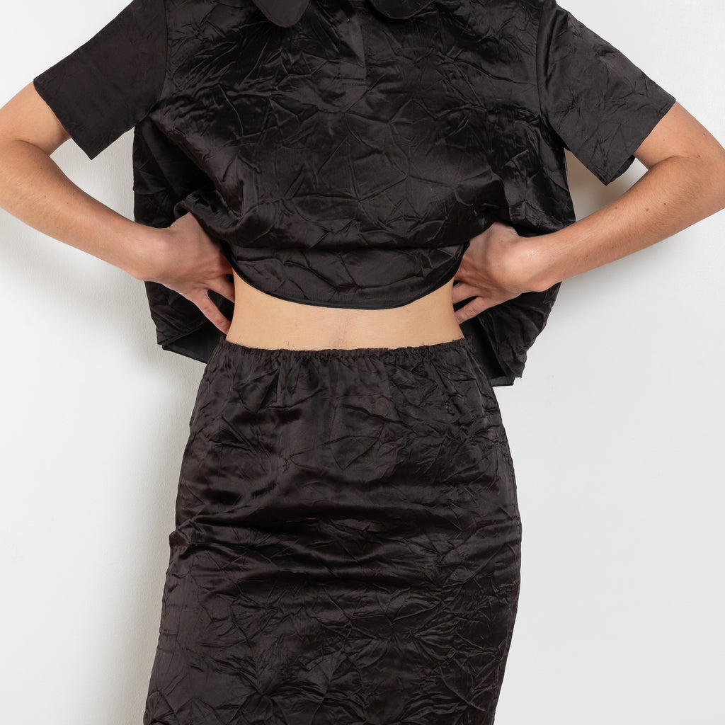 The Crayon Skirt by Nackiye is a knee length pencil skirt with raw edging and a slight noir petticoat reveal.