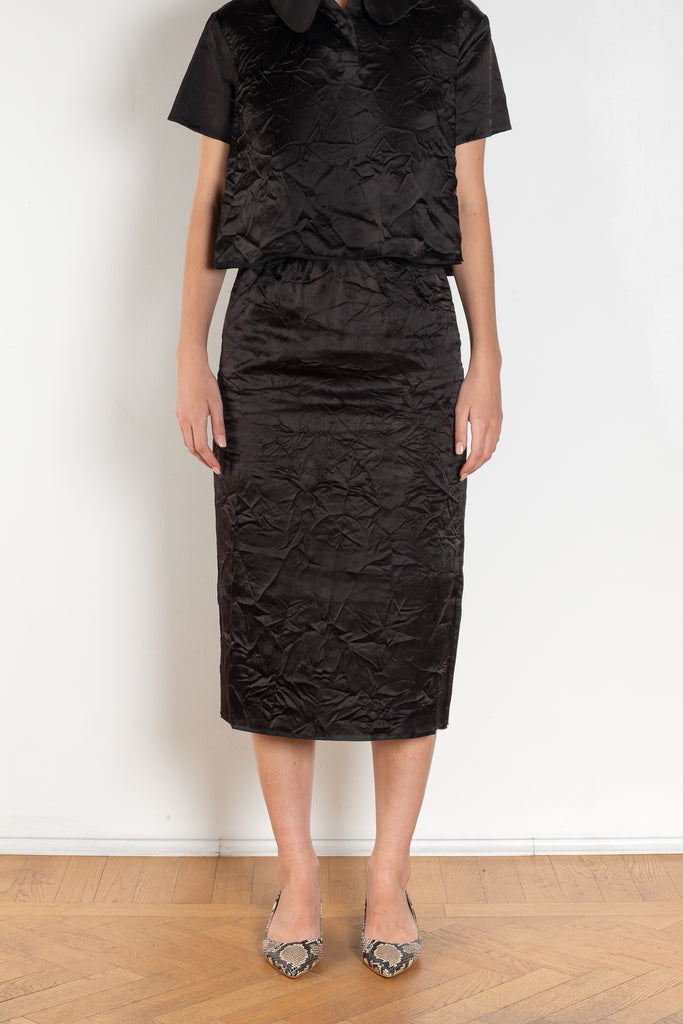 The Crayon Skirt by Nackiye is a knee length pencil skirt with raw edging and a slight noir petticoat reveal.