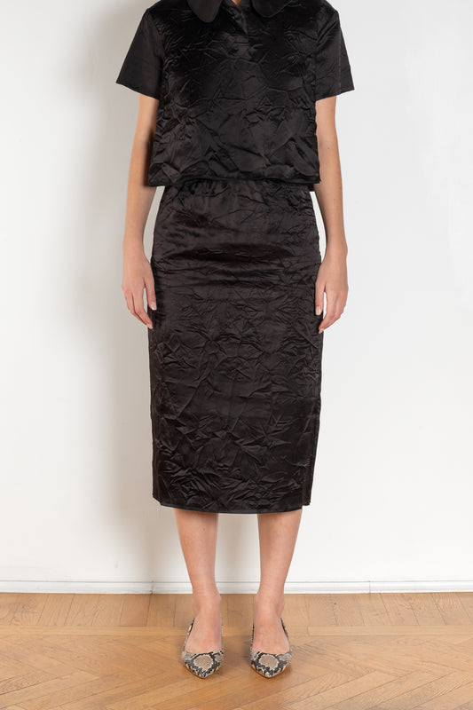 The Crayon Skirt by Nackiye is a knee length pencil skirt with raw edging and a slight noir petticoat reveal.