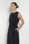 The Go Lightly Dress by Nackiye is a sleeveless ankle dress with exposed back and raw edging throughout