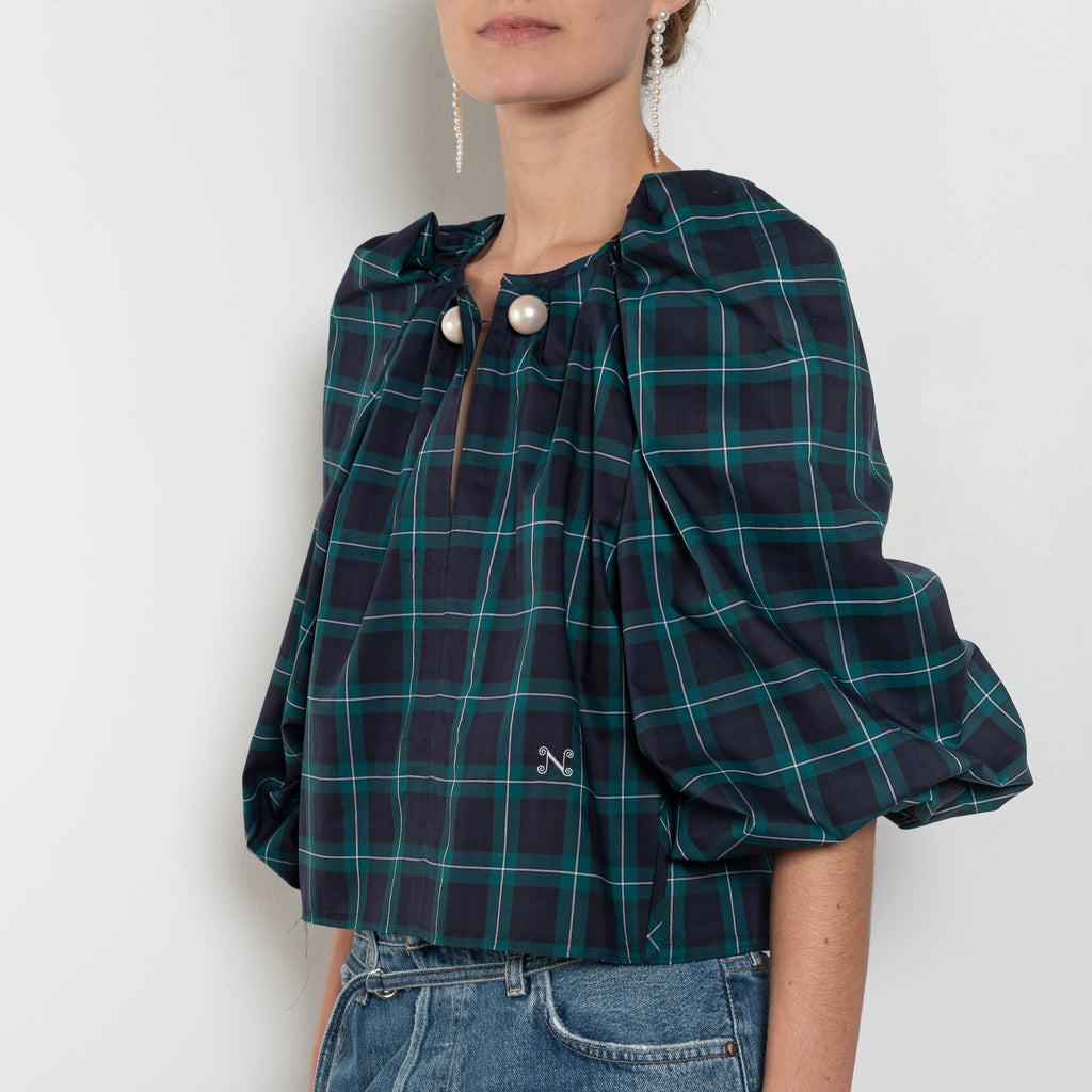 The Grand Bazaar Mini Top by Nackiye is a signature top with shawl shoulder feature and the classic double pearl neck pin in a mini version