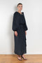 The Grand Bazaar Dress by Nackiye is a signature dress with shawl shoulder feature, two pockets, front slit and a belt, and the classic double pearl neck pin 