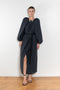 The Grand Bazaar Dress by Nackiye is a signature dress with shawl shoulder feature, two pockets, front slit and a belt, and the classic double pearl neck pin 