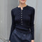 The Insider Knit Top by Nackiye is a classic button down knit top. The insider is close fitting in a soft, lightweight wool & silk