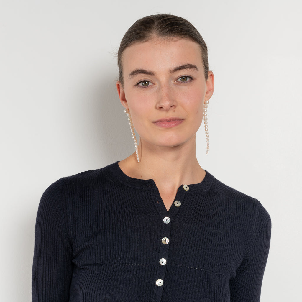 The Insider Knit Top by Nackiye is a classic button down knit top. The insider is close fitting in a soft, lightweight wool & silk