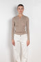 The Insider Knit Top by Nackiye is a classic button down knit top. The insider is close fitting in a soft, lightweight wool & silk, has a rounded v neckline