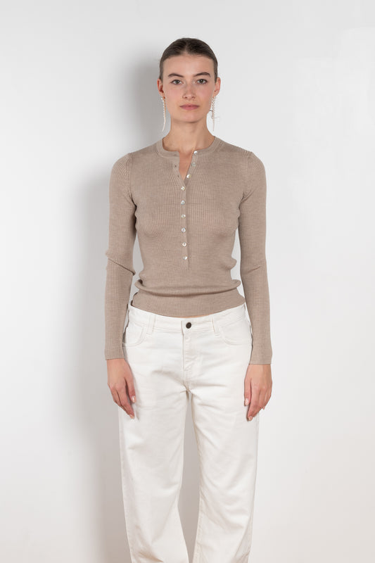 The Insider Knit Top by Nackiye is a classic button down knit top. The insider is close fitting in a soft, lightweight wool & silk, has a rounded v neckline
