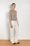 The Insider Knit Top by Nackiye is a classic button down knit top. The insider is close fitting in a soft, lightweight wool & silk, has a rounded v neckline