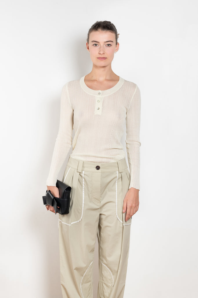 The Keep Close Top is a tightly ribbed buttoned Henley crew neck