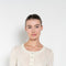 The Keep Close Top is a tightly ribbed buttoned Henley crew neck