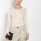 The Keep Close Top is a tightly ribbed buttoned Henley crew neck