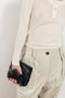 The Keep Close Top is a tightly ribbed buttoned Henley crew neck