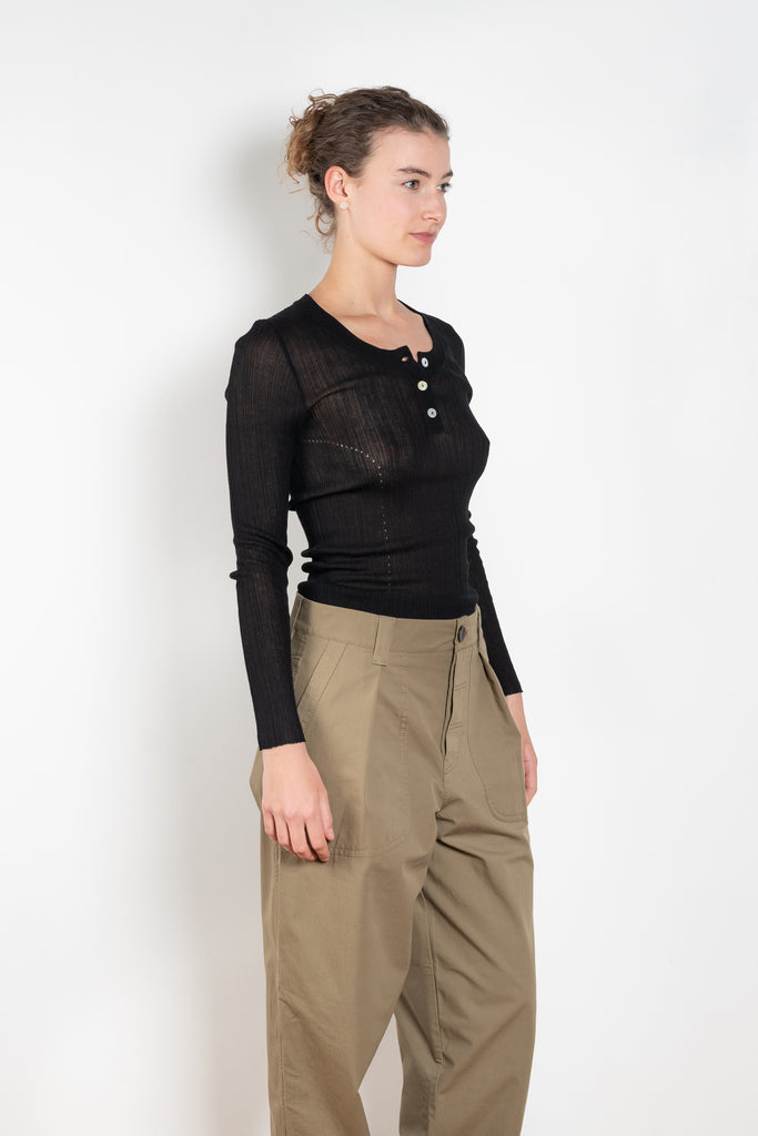 The Keep Close Top is a tightly ribbed buttoned Henley crew neck