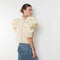 The Lolita Top by Nackiye has a boat neck, A-line silhouette and exaggerated scalloped sleeves