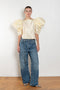 The Lolita Top by Nackiye has a boat neck, A-line silhouette and exaggerated scalloped sleeves
