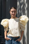 The Lolita Top by Nackiye has a boat neck, A-line silhouette and exaggerated scalloped sleeves