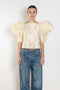 The Lolita Top by Nackiye has a boat neck, A-line silhouette and exaggerated scalloped sleeves