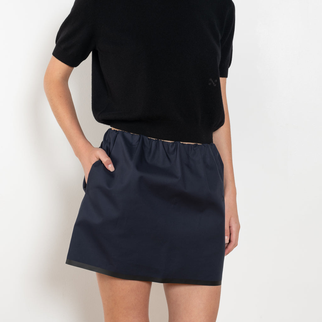 The Mini Skirt by Nackiye is gathered at the waist and featuring two side pockets, the little mini also has raw edging embellished with a rubber like piping