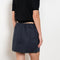 The Mini Skirt by Nackiye is gathered at the waist and featuring two side pockets, the little mini also has raw edging embellished with a rubber like piping