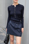 The Mini Skirt by Nackiye is gathered at the waist and featuring two side pockets, the little mini also has raw edging embellished with a rubber like piping