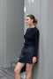 The Mini Skirt by Nackiye is gathered at the waist and featuring two side pockets, the little mini also has raw edging embellished with a rubber like piping