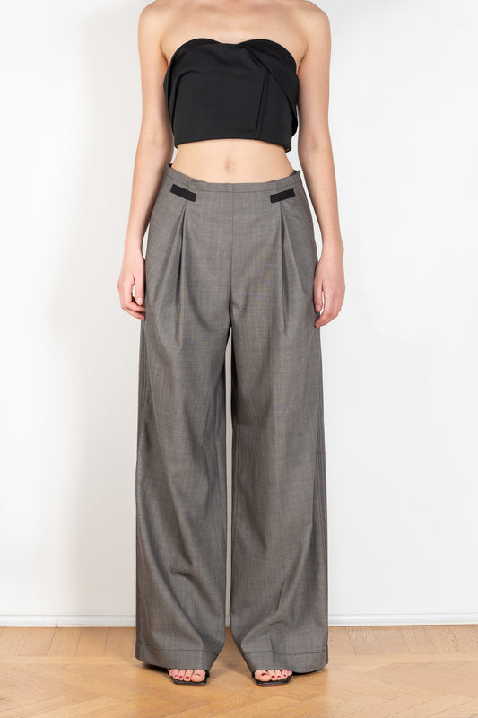 The Moonlighting Pant by Nackiye is a mid waist wool trouser with front pleats and a wide leg