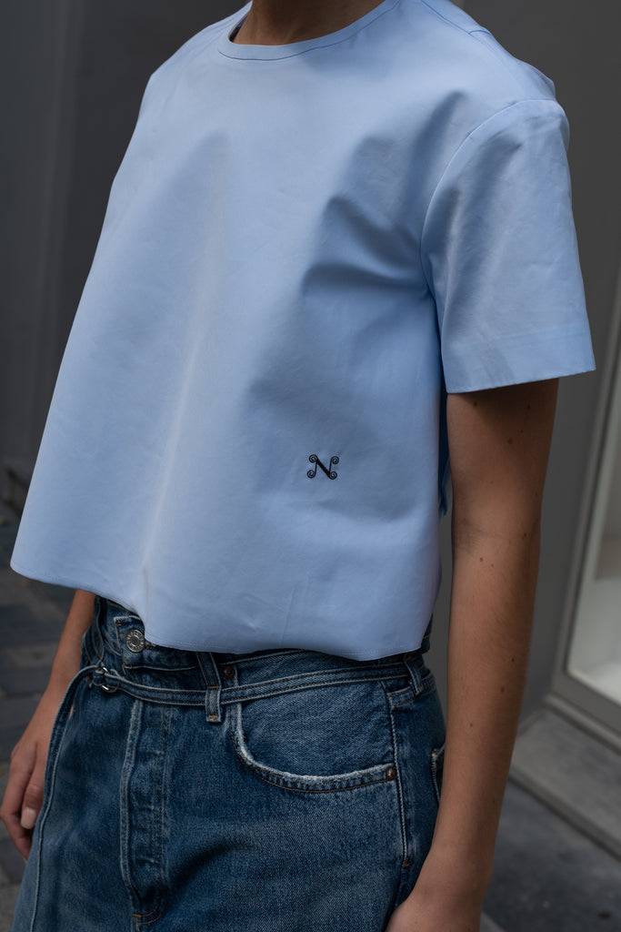 The Pixie Top by Nackiye is a fresh take on the classic shirt. Sleek A-line silhouette, short sleeves a detachable back belt
