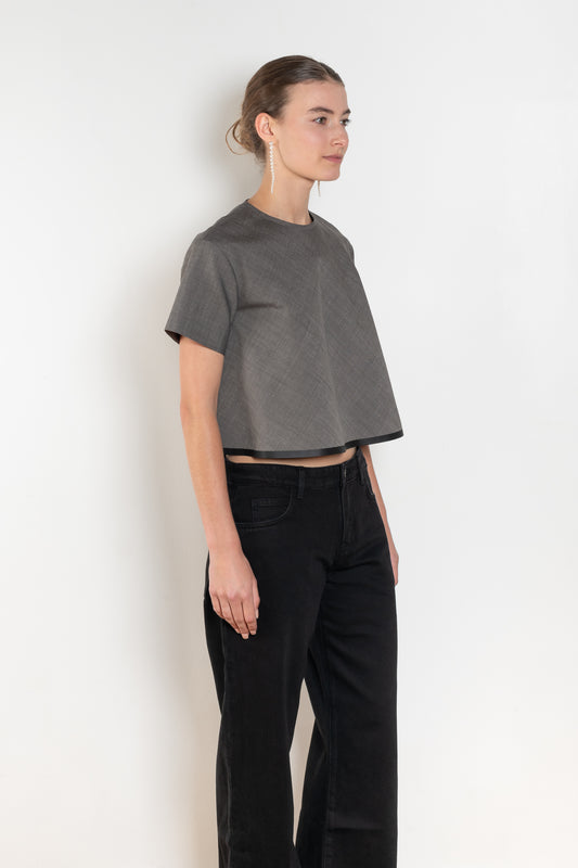 The Pixie Top by Nackiye is a fresh take on the classic shirt. Sleek A-line silhouette, short sleeves & a detachable back belt