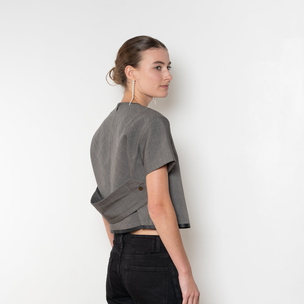The Pixie Top by Nackiye is a fresh take on the classic shirt. Sleek A-line silhouette, short sleeves & a detachable back belt