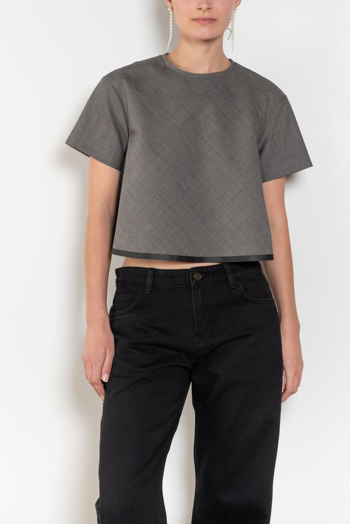 The Pixie Top by Nackiye is a fresh take on the classic shirt. Sleek A-line silhouette, short sleeves & a detachable back belt