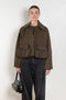 The Precious Cargo Jacket by Nackiye is a parka jacket with hand draped semi attached voluminous pockets and a leather collar
