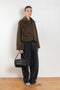 The Precious Cargo Jacket by Nackiye is a parka jacket with hand draped semi attached voluminous pockets and a leather collar