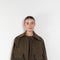 The Precious Cargo Jacket by Nackiye is a parka jacket with hand draped semi attached voluminous pockets and a leather collar