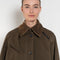 The Precious Cargo Jacket by Nackiye is a parka jacket with hand draped semi attached voluminous pockets and a leather collar