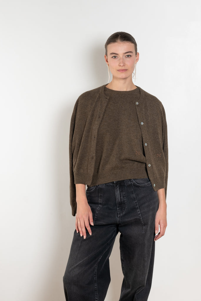 The Sea Shell Cardigan by Nackiye is a beautiful lightweight cashmere cardigan with mother of pearl buttons and lightly ribbed cuffs
