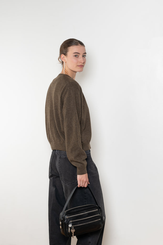 The Sea Shell Cardigan by Nackiye is a beautiful lightweight cashmere cardigan with mother of pearl buttons and lightly ribbed cuffs