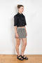 The Shortcut Shirt by Nackiye is a crop shirt with pointy collar and faux front pockets