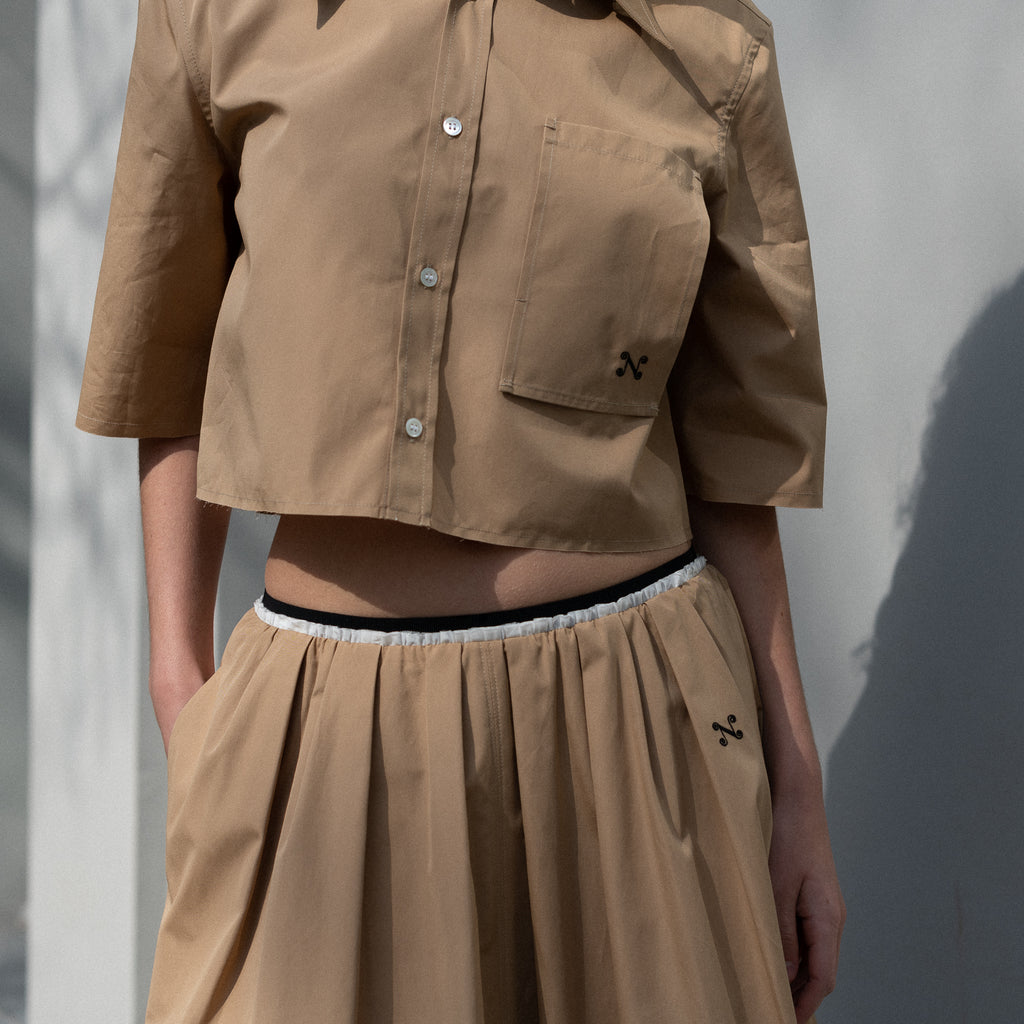 The Summer Wine Skirt by Nackiye is a gathered A-line circle skirt with cream waist frill edging and detached elastic inner waist.