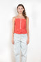 The Surf Rider Top by Nackiye is a delicate strappy top in cotton with a ruffle hem
