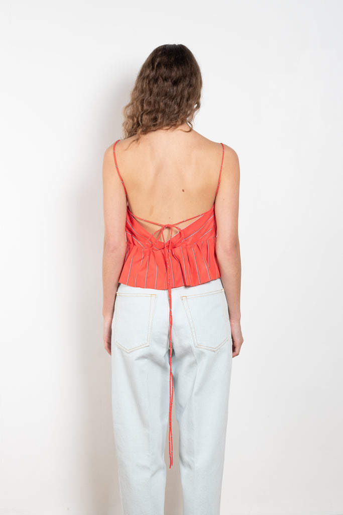 The Surf Rider Top by Nackiye is a delicate strappy top in cotton with a ruffle hem