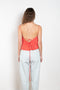 The Surf Rider Top by Nackiye is a delicate strappy top in cotton with a ruffle hem