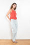 The Surf Rider Top by Nackiye is a delicate strappy top in cotton with a ruffle hem