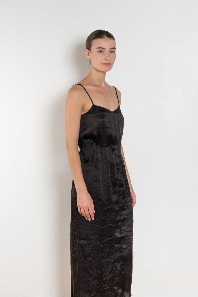 The Little Black Dress by Nackiye is a delicate slip dress with a gathered waist and mesh details
