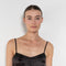 The Little Black Dress by Nackiye is a delicate slip dress with a gathered waist and mesh details
